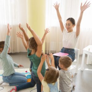 students-playing-game-with-their-kindergarten-teacher