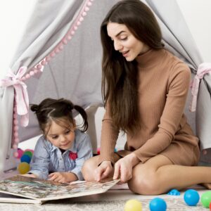 woman-playing-with-young-girl-tent
